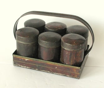 Antique set of tin spice canisters & carrier.
