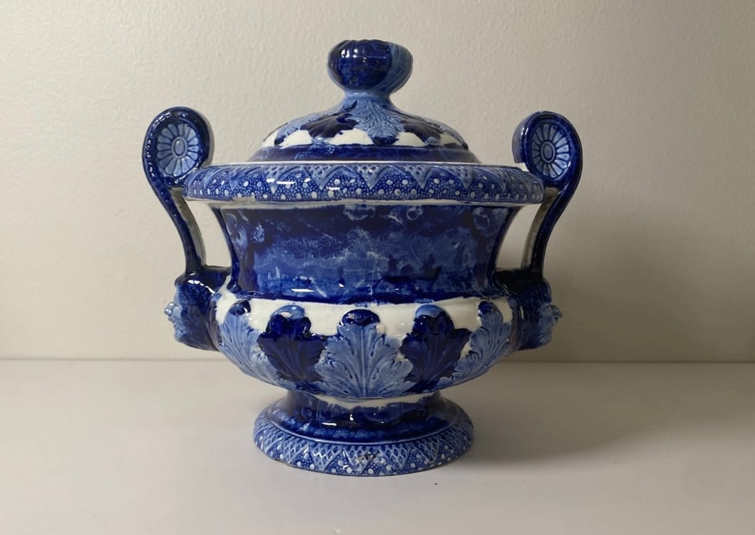 Historical Staffordshire Gravy Tureen 2 Men In A Sail Boat Shell Border : Historical Staffordshire blue gravy tureen with a view of 2 men in a sailboat. From Enoch Wood and Sons irregular shell border series with maritime views. Beautifully molded form with acanthus leaves