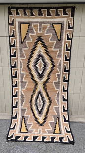 Large Two Grey Hills runner: Title: Large Two Grey Hills runner Dimension: 42" x 96" Description: A large, vibrant Two Grey Hills or Crystal Navajo woven runner rug ca 1940s.Minor condition issues with a couple small holes. No st