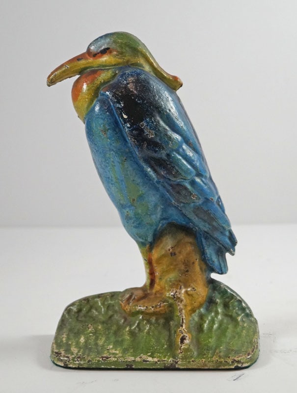 Antique Heron Bird Cast Iron Doorstop 1920’s: Title: Antique Heron Bird Cast Iron Doorstop 1920’s Dimension: 7 5/8” tall x 5” wide x 2 3/8” deep. Date: Ca. 1920’s. Additional Information: A very nice life-like Antiqu