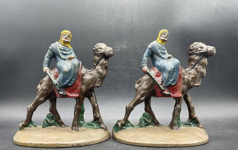 CAST IRON ARABIAN MAN RIDING CAMEL BOOKENDS #418 Hubley: Title: CAST IRON ARABIAN MAN RIDING CAMEL BOOKENDS #418 Hubley Date/Period: approx 1920-30's's Dimension: approx 6 x 5 x 2.25 Material: metal Additional Information: CAST IRON ARABIAN MAN RIDING CAMEL