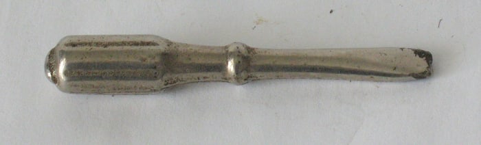 Vintage cast iron screw driver paper weight.