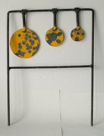 Vintage metal spinning shooting gallery target.
