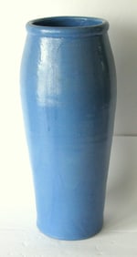 Vintage pottery vase with a blue glaze.