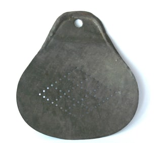 Antique tin kitchen skimmer tool.
