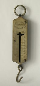 Antique brass spring scale from Chicago.