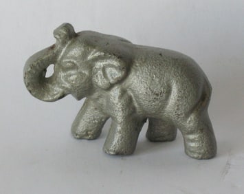 Antique cast metal elephant paper weight.