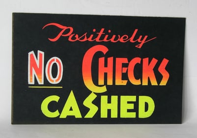 Vintage trade sign “No Checks Cashed”.
