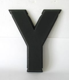 Vintage cast metal letter “Y”.