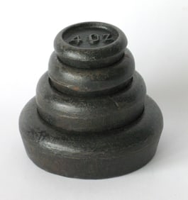 Set of antique cast iron country store scale weights.