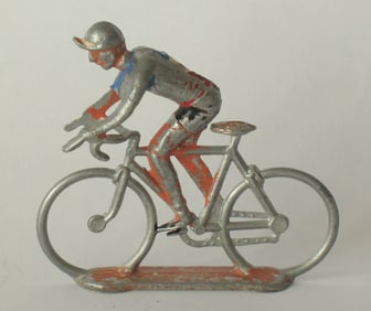 Antique cast metal bicycle & rider.