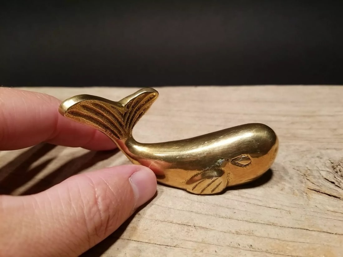 Brass Whale Paperweight Desk Statue: 3" Long x 1" wide 1lb 8oz Very accurate and well made reproduction of an antique paperweight. All solid brass. Certainly easy to wonder its age Reserve: $13.00 Shipping: Domestic: Flat-rate of $8.00 t