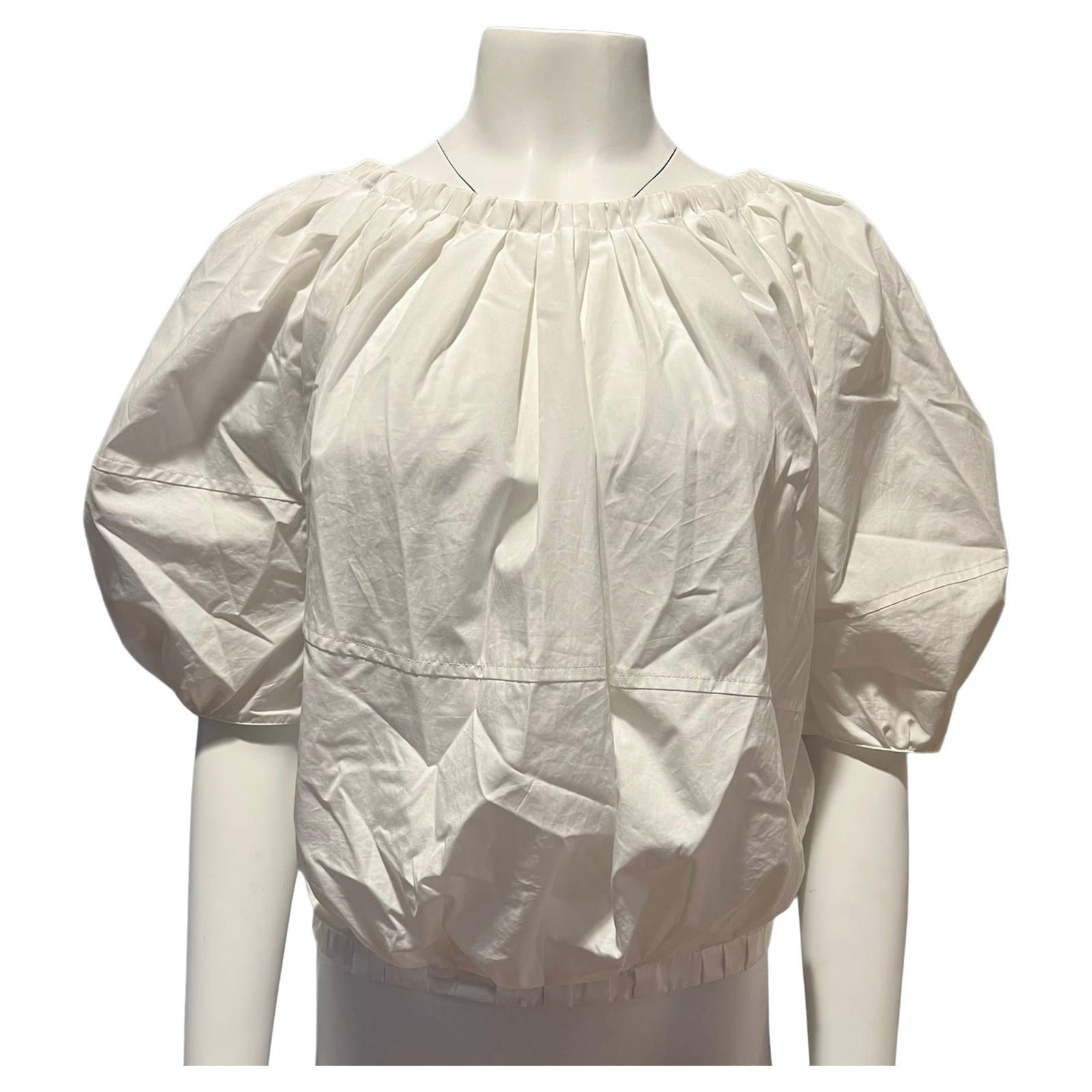 Marni White Top Blouse, Size 40: About the Item - 100% cotton - Cropped design - Short sleeves length with button closure - Features balloon sleeves - Bow detail Designer: Marni Dimensions: Length: 20 in (50.8 cm)Marked Size: 40 (EU)