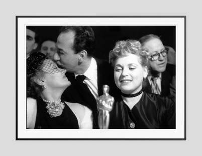 Slim Aarons 'Bad Luck Gloria' 1951 Oversize Black Frame Silver Gelatine Resin Print: Description Slim Aarons 'Bad Luck Gloria' 1951 Oversize Black Frame Silver Gelatine Resin Print American actor Jose Ferrer (1912 – 1992) commiserates with Gloria Swanson after losing out in