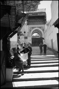 Edition of 10 - The Streets of Fes; 2015: Edition of 10 - The Streets of Fes, Morocco, Silver Gelatin Photograph Edition of 10 + 5 APs. Front: Signature and edition number with artists blind stamp. Back: Ink stamp and print details. Mounted:
