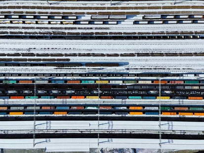 Drone Point View Of Freight Trains And Railway Station In Winter By Aerialperspective Images: Description "Drone Point View of Freight Trains and Railway Station in Winter" by AerialPerspective Images A shot captured by a drone presenting a vibrant set of freight trains at a station in
