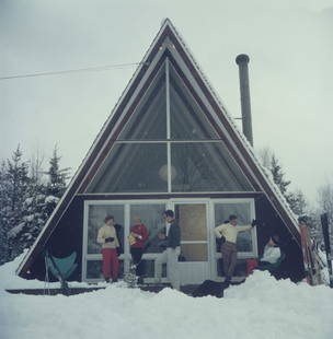 On The Slopes In Stowe ' By Slim Aarons Oversized C Type: Description ' On The Slopes In Stowe ' by Slim Aarons Five people relaxing on the terrace of the glass-fronted triangular Skaal House in the Stowe Mountain ski resort in Stowe, Vermont, 1962. The