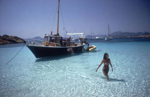 Slim Aarons 'Yachting Trip' 1967 Oversize Unframed C Type Print: Description Slim Aarons 'Yachting Trip' 1967 Oversize Unframed c type print Selvaggia Borromeo wades ashore from her yacht during a holiday on the Costa Smeralda in Sardinia, August 1967. (Photo by