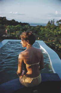 Poolside In Kenya ' By Slim Aarons Oversized C Type: Description ' Poolside In Kenya ' by Slim Aarons A woman sits at the edge of a swimming pool in Kenya, December 1958. (Photo by Slim Aarons/Hulton Archive/Getty Images) Paper size 40 x 60 inches