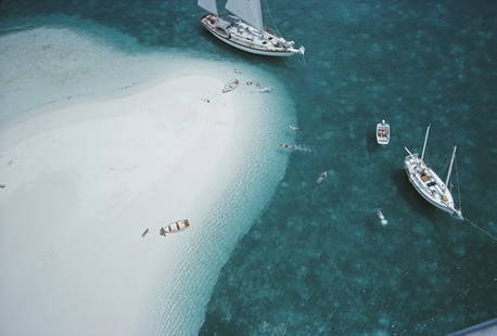 Stocking Island, Bahamas ' By Slim Aarons Oversized C Type: Description ' Stocking Island, Bahamas ' by Slim Aarons A high angle view of people swimming next to the ketch 'Traveler II' , Stocking Island, Bahamas, 1964. (Photo by Slim Aarons/Hulton