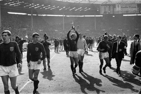 World Cup Winners' 1966 Silver Gelatin Print Framed In White: Description 'World Cup Winners' 1966 Silver Gelatin Print Framed In White England captain Bobby Moore (1941 – 1993) holds up the Jules Rimet trophy after his team’s victory over West
