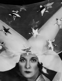 Two Horned Hat ' By Sasha Oversized: Description ' Two-Horned Hat ' by Sasha 5th November 1929: Lady Castlerosse modelling the medieval-style costume and wimple she will wear to the Galaxy Ball Pageant, held at London's Park Lane