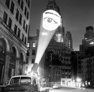 Skyjecting ' By F. Roy Kemp, 2010s: Description ' Skyjecting ' by F. Roy Kemp February 1960: An image of a eye is projected onto a building at New York by a skyjector. (Photo by F. Roy Kemp/BIPs/Getty Images) Paper size 12 x 12