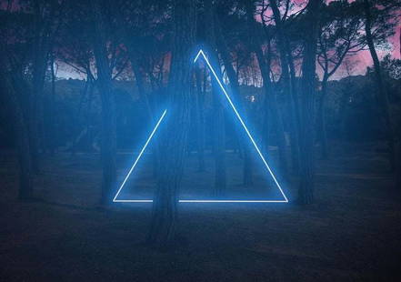 Blue Neon Triangle Light Between Pine Trees With Futuristic Visual Effect By Artur Debat: Description "Blue neon triangle light between pine trees with futuristic visual effect" by Artur Debat Light painting performance at night in the forest. Unframed C Type Print Print size 30 x 40