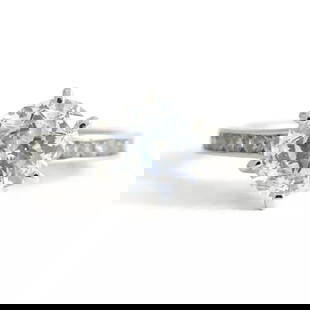 Round CZ Cubic Zirconia Channel-Set Engagement Ring 14K White Gold, 2.54 Grams: Round CZ Cubic Zirconia Channel-Set Engagement Ring 14K White Gold, 2.54 Grams This is a beautiful engagement ring! Please let us know if you have any questions. Gemstones: 1.70 ctw; 1 round cubic zir