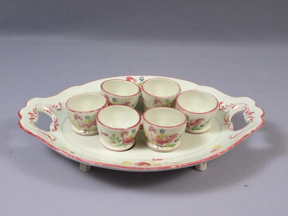 UNIQUE K&G Ket G Luneville France Blue EGG CUP Serving Dish Faience Hen: This is an unique and hard to find EGG Cup Serving Dish. The dish was made in France by K&G . It was made around 1890s. It is faience. The pattern features pink flowers and hens/roosters. It is a serv