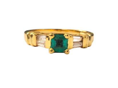Vintage 1ct Emerald & Diamond Ring in 14k Gold: Metal: 14k yellow gold. Center: Colombian 0.80ct Emerald, princess cut. Side diamonds 0.20cwt, SI2 clarity, G color, baguette cut. All stones are 100% natural earth mined. Ring size: US 7. Vintage