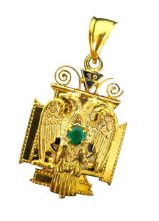 Mid Century European 1.20 Carat Emerald Religious Cross: Metal: 10k yellow gold. Gemstone: 1.20 carat emerald. Round shape. Excellent color and saturation. Total weight: 20.60 grams. Dimensions: 1.76 x 0.94 inches. Vintage European religiois cross pendant