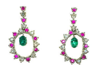 Cocktail Emerald Diamond Ruby Dangle Earrings: Metal: 14K white gold. 1.00cwt Burma ruby, round cut. 4.00cwt Colombian emerald, oval cut. 1.00cwt diamonds; VS clarity and F-G color. Round brilliant cut diamonds. TCW of all precious stones: 6.00