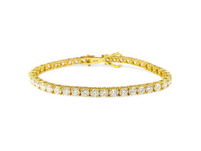 10.50 Carat VVS Diamond Tennis Bracelet in 14k: Metal: 14k yellow gold. Diamonds: 10.5 CWT. Clarity: VVS. Color: H-I. 100% natural earth mined diamonds. 7 inches. Unisex diamond tennis bracelet Reserve: $19,800.00 Shipping:Domestic: Shipping
