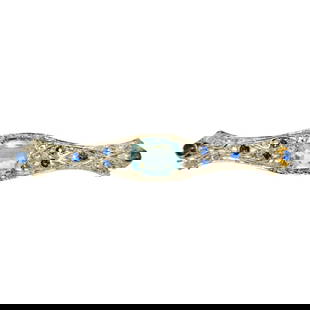 Sapphire Diamond Aquamarine Ladies Estate Pin: Metal: 18k white gold. Diamonds: 0.90 cwt. SI clarity and G color. Rose cut diamonds. Sapphire: 0.25 cwt (approx). Color: blue. Aquamarine: 11.87 x 9.06mm stone. 4.50 carat aquamarine set in prongs.