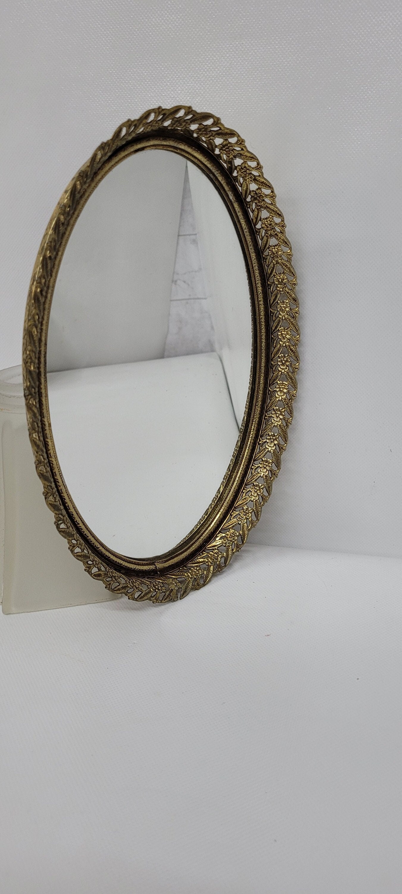 Vintage Gold Filigree Mirror Vanity Tray - Round Tray: This small gold filigree mirror vanity tray is in nice 1960's-1970's vintage condition. It is a round tray and perfect for a smaller spot on your dresser or vanity. It even has a metal loop on the bac