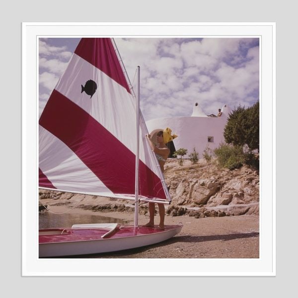 Slim Aarons 'Bettina Graziani' 1964 Oversize White Frame C Type Print: Description Slim Aarons 'Bettina Graziani' 1964 Oversize White Frame c type print French fashion model Bettina Graziani (Simone Micheline Bodin) (1925 – 2015) adjusting the sail of a boat, Costa