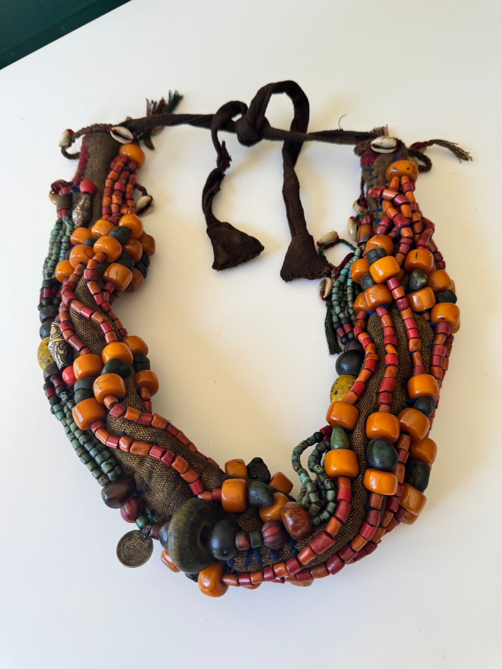 Headhunters warrior necklace - Naga - India Mid 20th century: Old Naga Head Hunter Warrior's Ceremonial Necklace. Hand carved Shells; All Strung on the Original Hand Woven Fiber String. Naga headhunting includes mortification of the rival, ritual violence, cosmo