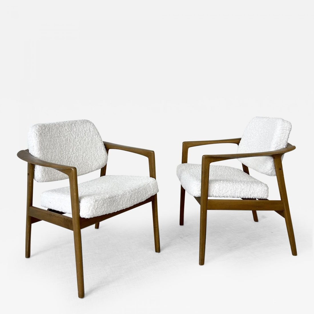 Pair of Mid-Century Modern Arm / Lounge Chairs, Oak, Sheepskin, Sweden, 1970s: Description: Pair of Mid-Century Modern Arm/Lounge Chairs, Oak, New Wool Shearling/Sheepskin Modernist lounge chairs in a luxurious genuine white shearling fabric. The frames are made of solid oak and