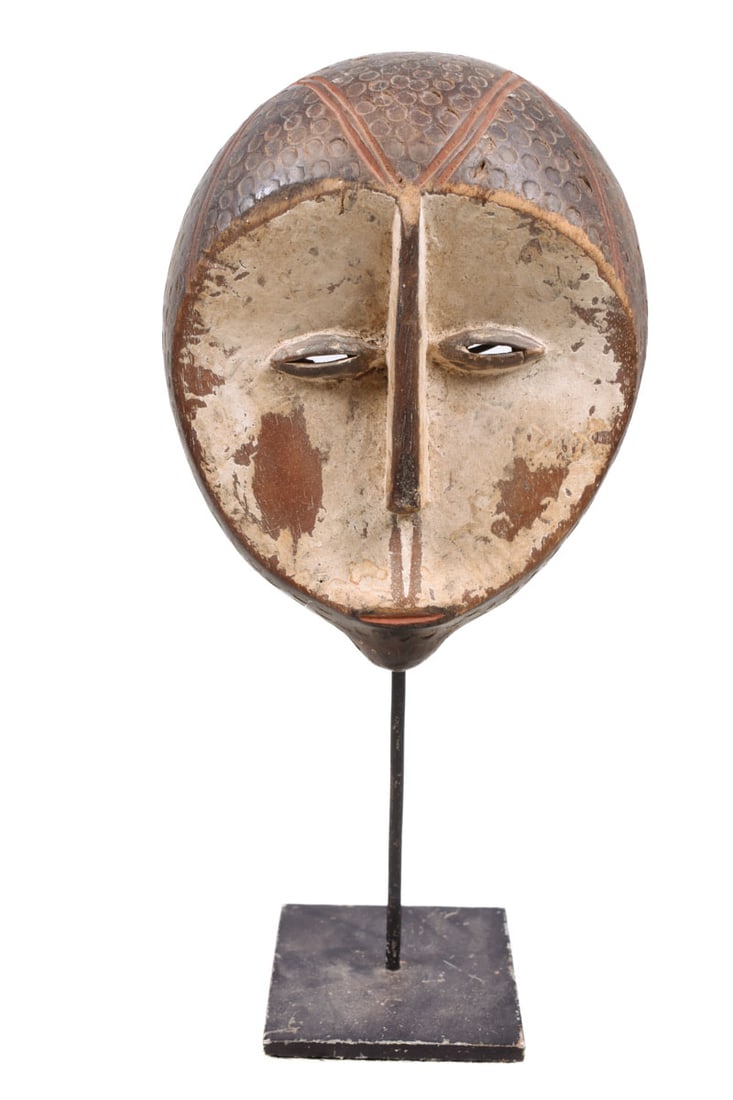 Mask – Wood – Kwele – Gabon: Beautiful hand carved wooden mask of the Kwele tribe living in Gabon. The Kwele use several types of masks in ceremonies to promote harmonious interaction and group solidarity. Kwele masks, many with 