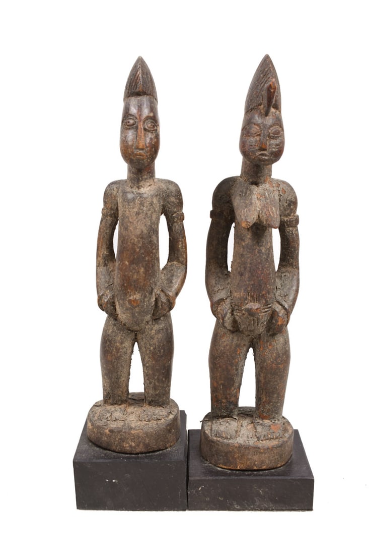 Ancestor Couple – Wood – Senufo – Ivory Coast: Stylistic and old standing wooden ancestor couple from the Senufo tribe of Ivory Coast. The Senufo (the francophone spelling Senoufo is commonly used) are an ethnolinguistic group composed of diverse 