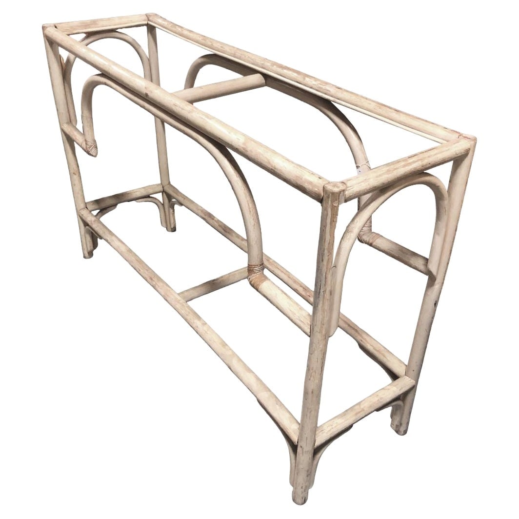 Restored Natural White Rattan Console Sofa Table: About the Item Elevate your entryway with this restored Paul Frankl-inspired white rattan console sofa table. Crafted with a large center arch and corners finished in wicker wrappings, this piece comb