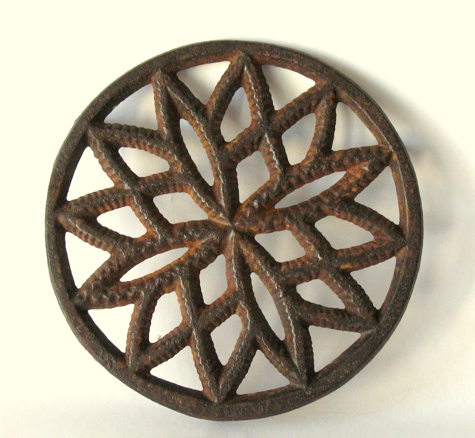 Antique cast iron Pennsylvania hearth trivet.: Title: Antique cast iron Pennsylvania hearth trivet. Date/Period: 1930's Dimension: 5 1/4” diameter Additional Information: Nice antique cast iron Pennsylvania heath trivet in all original patin