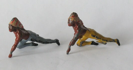 Group of vintage cast metal toy Indians.