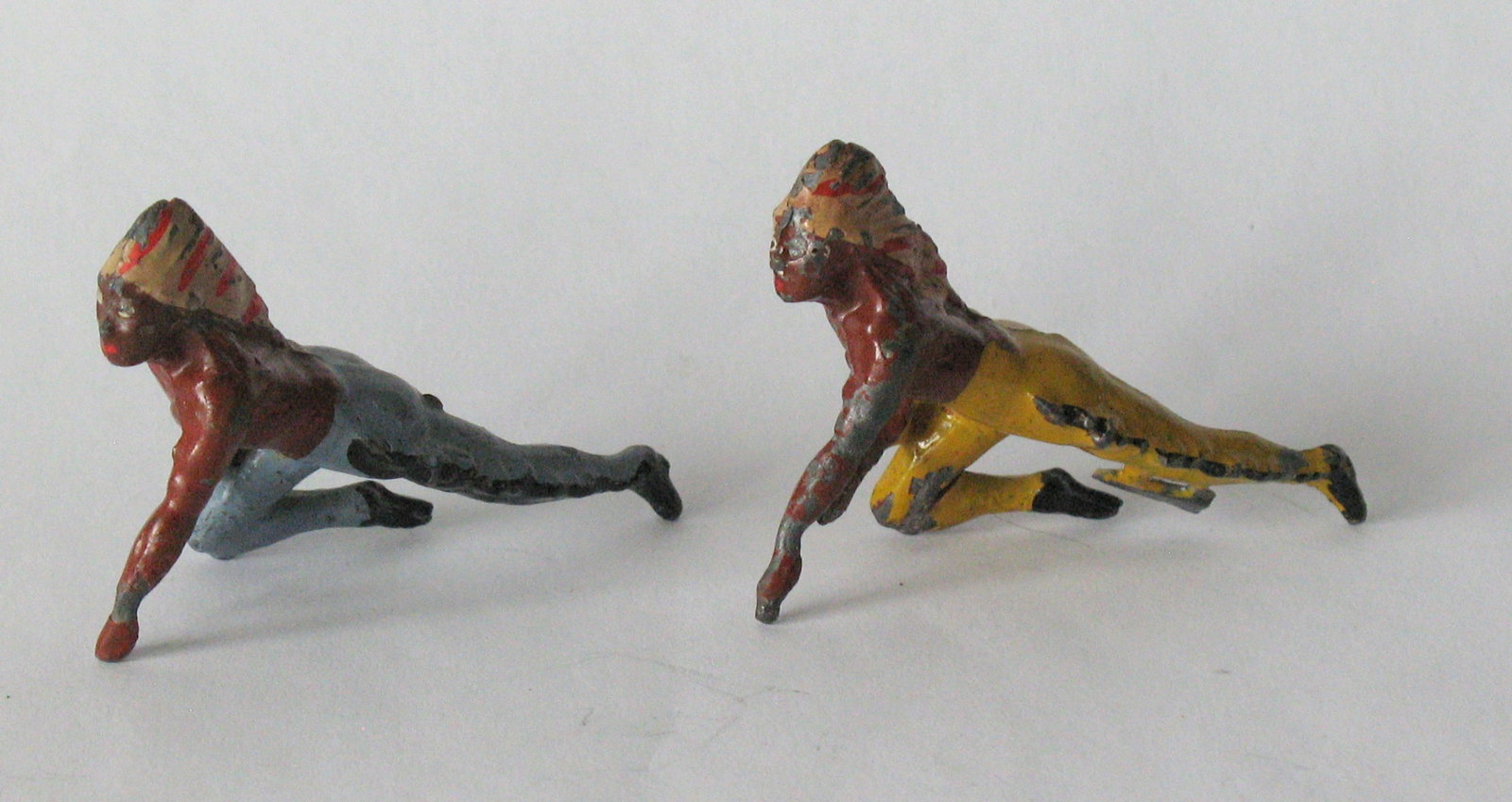 Group of vintage cast metal toy Indians.: Title: Group of vintage cast metal toy Indians. Date/Period: 1950's Dimension: 2 1/4” long Additional Information: Group of vintage cast metal toy Indians in great original paint & condition. Sh