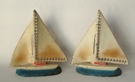 Antique cast iron sailboat bookends original paint.