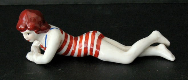 Antique porcelain bathing beauty figurine.