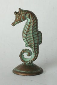 Antique cast brass seahorse paper weight.