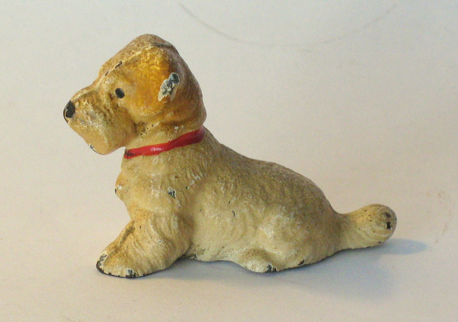 Antique cast iron Spaniel paper weight.: Title: Antique cast iron Spaniel paper weight. Date/Period: 1930's Dimension: 2” x 1 1/2” Additional Information: Nice antique cast iron Spaniel paper weight made by Hubley in all original