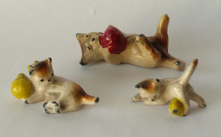 Group of three antique cast iron cat paper weights.